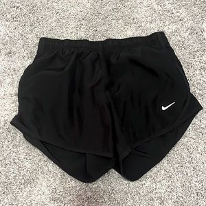 black nike athletic shorts.